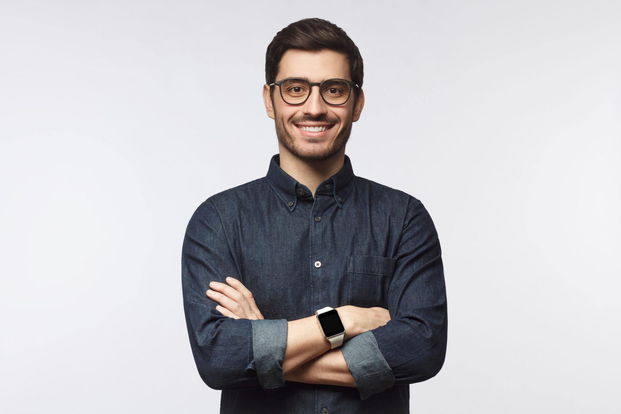 Man with crossed arms isolated on gray background